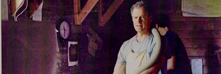 NC potter Mark Hewitt with a clay coil for a large pot in Pittsboro, NC 2005. Photo credit Tom Mould.